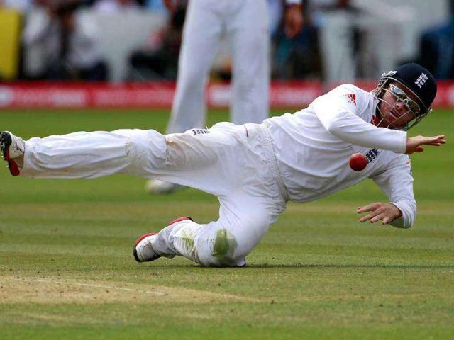 England's Ian Bell dives to stop a ball during the final day of the first cricket Test match against India at Lord's in London.