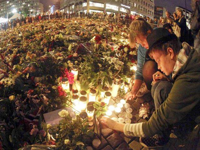 People-are-treated-at-the-scene-after-an-explosion-in-Oslo-Norway People-are-treated-at-the-scene-after-an-explosion-in-Oslo-Norway
