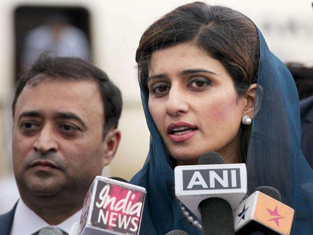 Foreign minister of Pakistan, Hina Rabbani Khar, talking to reporters on her arrival at Air Force Station Palam in New Delhi.