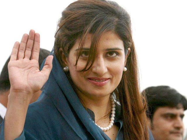 Pakistan's foreign minister Hina Rabbani Khar waves as she arrives at the AFS Palam, in New Delhi.
