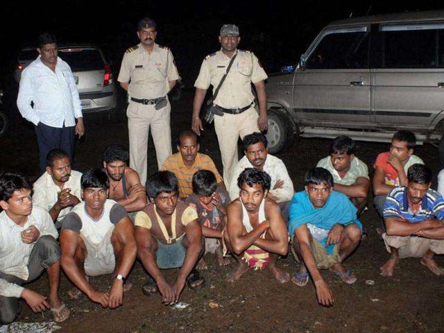 Members of a racket involved in unlawful sand dredging after their arrest by the police in Thane, Mumbai.