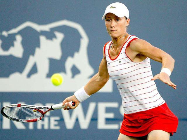 Samantha Stosur of Australia returns a shot to Sabine Lisicki of Germany during the Bank of the West Classic at the Taube Family Tennis Stadium in Stanford, California.