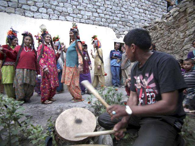 Aryan Brogpa women, wearing traditional outfit, dance at Darchik, in Kargil district of Jammu and Kashmir.