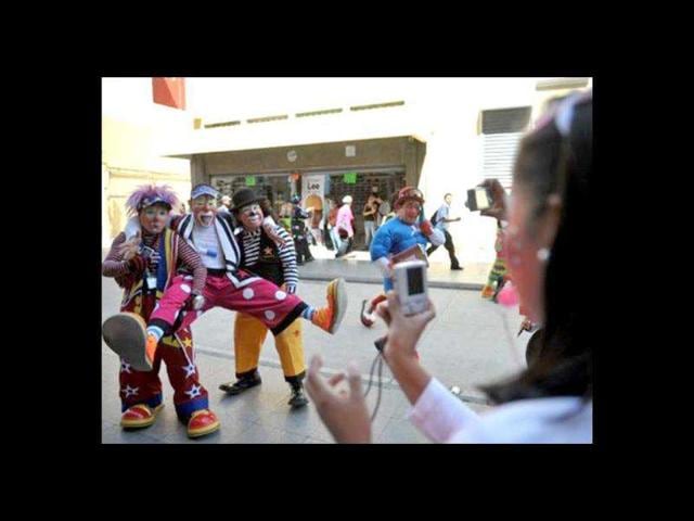 A group of clowns pose for the camera during a parade in the historic centre of Guatemala City in the framework of the III Latin American Clown Congress. Over 200 brightly-coloured clowns from North and Central America and the Caribbean gathered in Guatemala city for the III Latin American Clown Congress to exchange ideas and attend workshops.