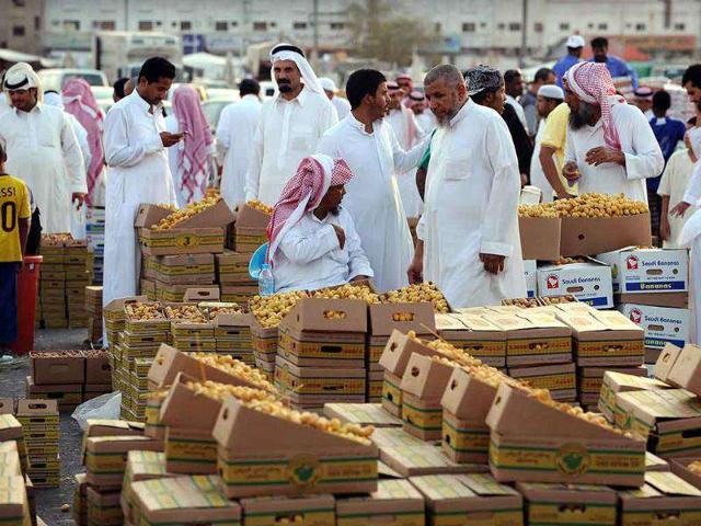 Saudis buy and sell dates on the eve of the Muslim holy fasting month of Ramadan at a market in Riyadh.