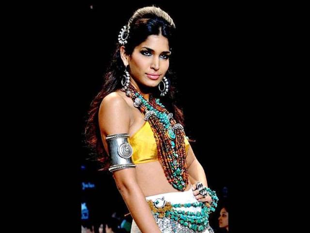 A pleasant change from the metals, a model showcases some tribal and ethnic jewellery from Amrapali during the Indian International Jewellery Week, 2011. (AFP)