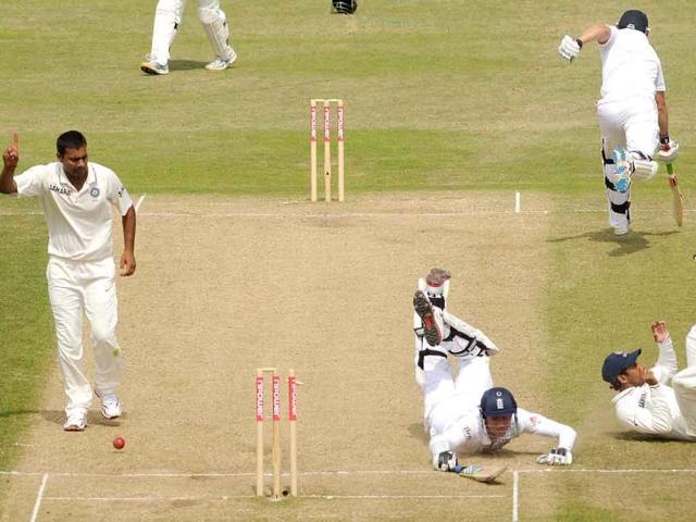 England's Stuart Broad (3rd R) is run out by India's substitute fielder Wriddhiman Saha (R), as Praveen Kumar (L) reacts, during the second cricket Test match against India at Trent Bridge in Nottingham.