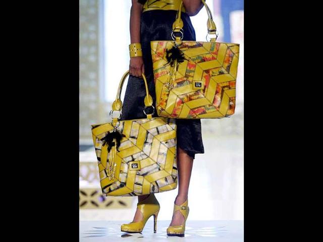 A model presents creations by designer Gabi Arenas during the XXIV International Footwear and Leather Show in Bogota.