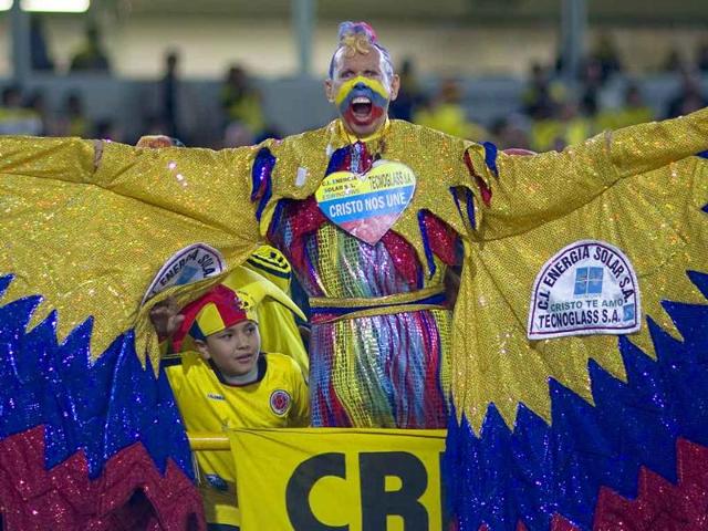 Colombia's fan known as 'El Cole' cheers prior to a U-20 World Cup group A soccer match against Mali in Bogota, Colombia.