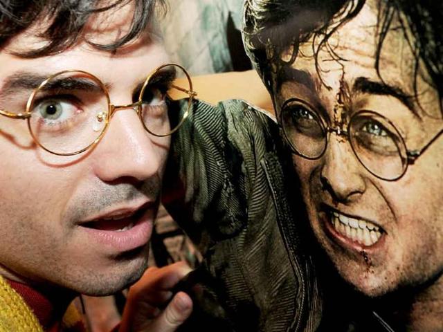 Diehard fan Saul Diaz from Beijing posing for the camera as he arrives before a midnight screening of the latest and final Harry Potter film, Harry Potter And The Deathly Hallows - Part 2, in Beijing.
