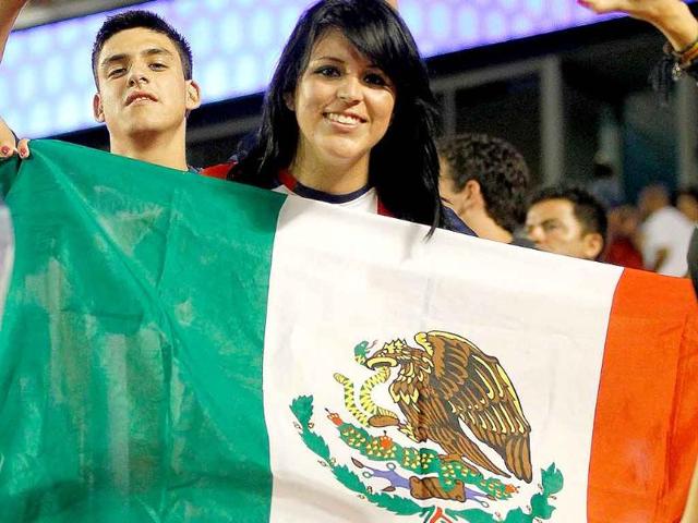A CD Guadalajara fan reacts to winning a game against FC Barcelona during the 2011 World Football Challenge at Sun Life Stadium in Miami Gardens, Florida.