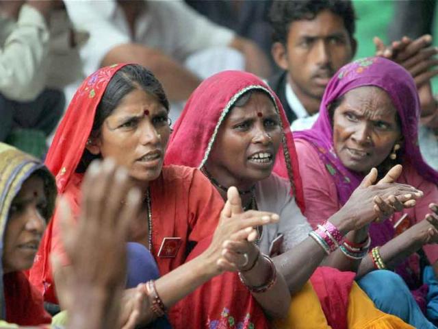 Women take part in a dharna demanding repeal of Land Acquisition Act 1894 and protection of water, forest , land, minerals and livelihood rights, at Jantar Mantar, New Delhi