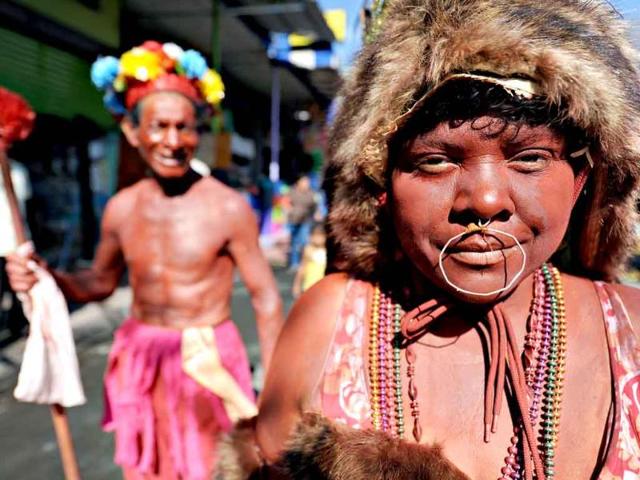Parishioners in typical attires dance during festivities in honor of Managua's Patron Saint, St Dominic of Guzman, at the Oriental Market in Managua.