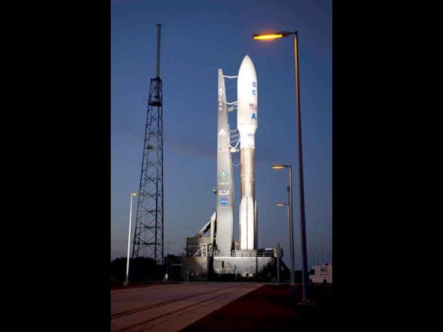 An Atlas V rocket with Nasa's Juno spacecraft payload is seen the evening before it's planned launch at Space Launch Complex 41 of the Cape Canaveral Air Force Station in Florida.