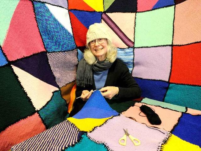 Mimi Daw knits a blanket during the annual 'Knit In' for the 'Wrap With Love' charity in Sydney.