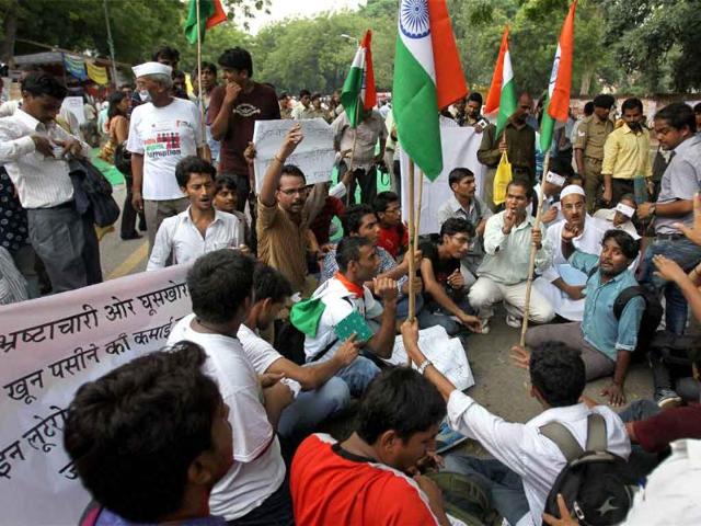 Supporters of social activist Anna Hazare protest against the introduction of the government's version of the Lokpal bill at Jantar Mantar, New Delhi