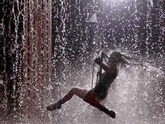 An artist performs during the Waterwall show in Lisbon.