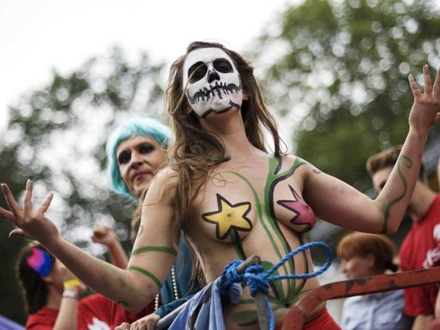 A partipant displays body painting during the HBTQ festival Stockholm Pride parade in central Stockholm.