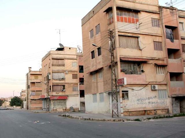 In this photo taken during a government organized tour, streets are deserted in the central city of Hama, Syria. In the besieged city of Hama, the government has cut off electricity and communications, while a rights group said eight babies died because their incubators lost power.