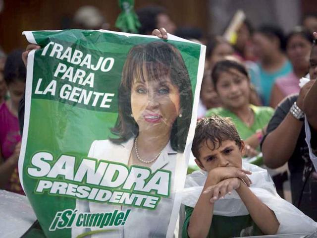 Supporters of Guatemala's former first lady Sandra Torres protest outside the Constitutional Court in Guatemala City.