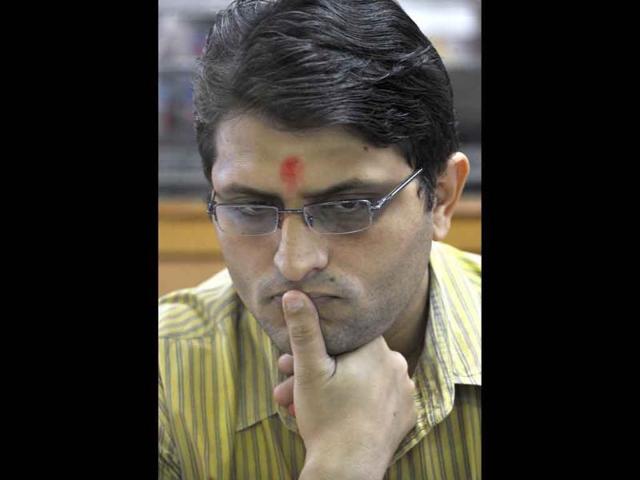 A stock broker reacts while watching share prices on his screen during intraday trade at a brokerage house in Mumbai. Stocks fell nearly 3 % at the opening of trade, tracking plunging Asian markets after sharp losses on Wall Street overnight.