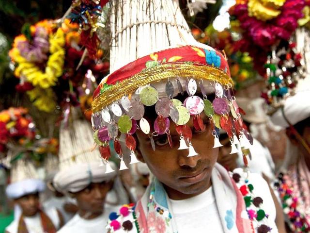 Indegenious tribal men take part in a gathering in New Delhi to celebrate the United Nations' International Day of the World's Indigenous People.