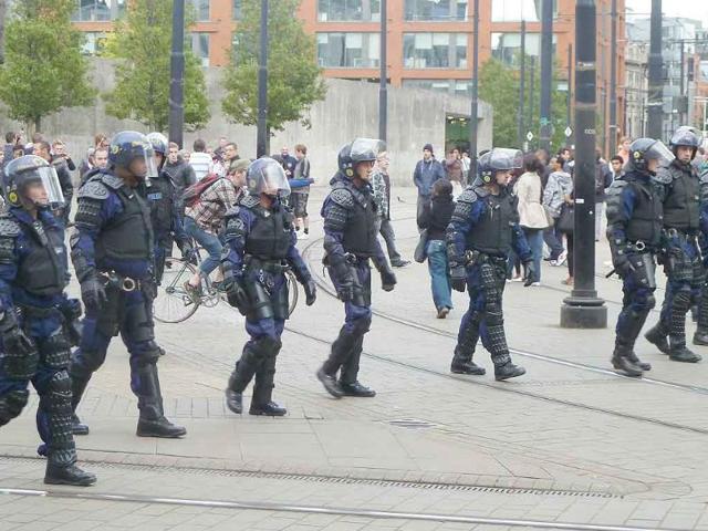 Riot police patrol Manchester city centre after trouble on Market street.
