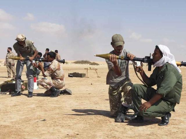 Rebel fighters operate rocket-propelled grenade (RPG) launchers during training in Geminis.