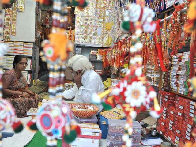 A woman shops for rakhis (sacred threads) in Hyderabad ahead of the Raksha Bandhan festival. The annual Raksha Bandhan festival is celebrated by sisters tying a colorful thread, a simple bracelet, or a decorative string around the wrist of her male siblings as a sign of love and affection.