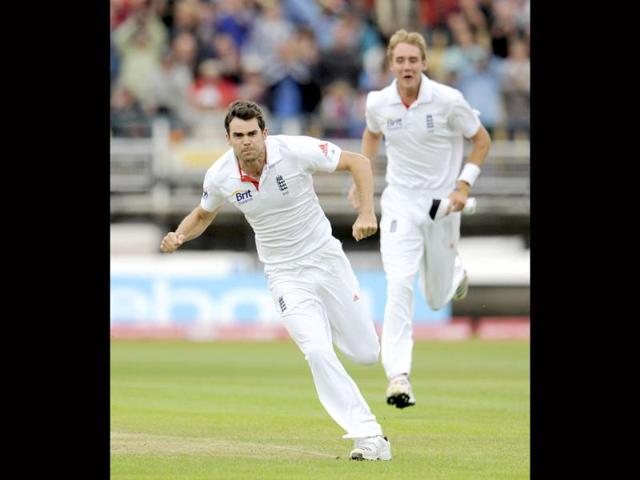 James Anderson celebrates after dismissing Virender Sehwag as Stuart Broad (R) looks on during the third cricket Test at Edgbaston, Birmingham.
