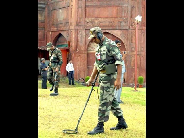 Indian army soldiers check around the Red Fort before a full dress rehearsal for Independence Day celebrations in New Delhi.