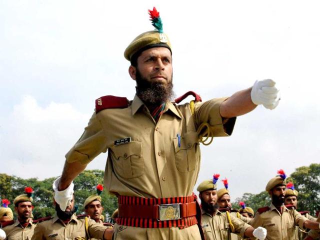 Policeman march during a full dress rehearsal for Indian Independence Day Celebrations in Srinagar.