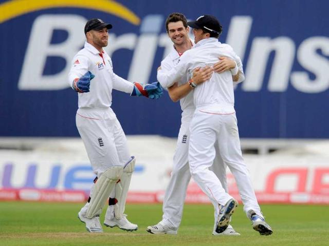 England-s-James-Anderson-C-embraces-teammate-Graeme-Swann-as-Matt-Prior-L-looks-on-after-the-dismissal-of-Gautam-Gambhir-during-the-third-cricket-Test-match-at-Edgbaston-cricket-ground-in-Birmingham-England