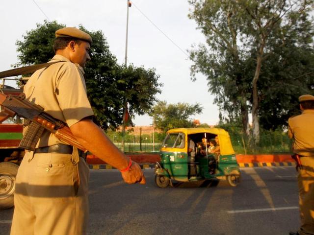 Indian police personnel stand guard at a police barricade near the Red Fort in New Delhi.