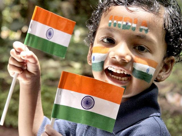 A boy with the National flag painted on his face on the eve of Independence Day in Kozhikode.
