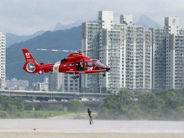 A firefighter is pulled up from a river during an anti-terror exercise as part of Ulchi Freedom Guardian exercise in Seoul, South Korea.