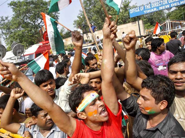 Supporters of Anna Hazare shout slogans outside Tihar prison, where Hazare is presently lodged, in New Delhi Thursday.