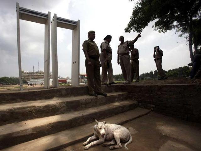 Delhi policemen stand near metal detectors as they prepare for a public protest headed by anti-corruption activist Anna Hazare in New Delhi.
