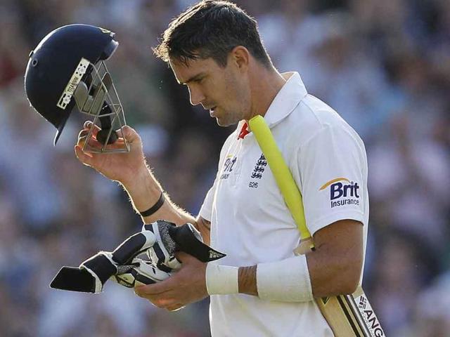 Kevin Pietersen leaves the field after being dismissed for 175 runs in their fourth test match against India, at the Oval cricket ground in London.