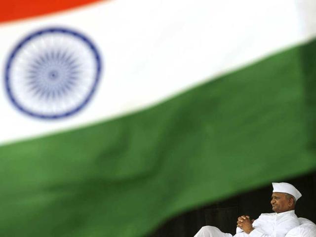 Anna Hazare sits on the stage during his hunger strike against corruption in New Delhi.
