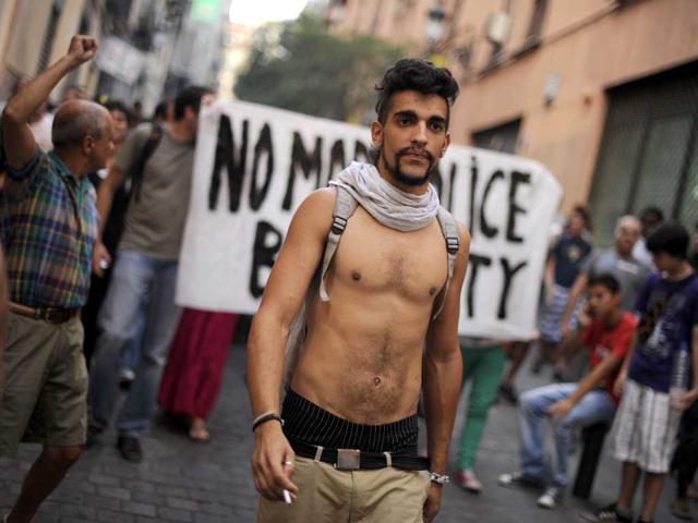 Protesters march in central Madrid to protest a visit by Pope Benedict XVI and police violence during previous demonstrations, as the pontiff presided over a service a few hundred metres away. The activists were angry over the cost of the World Youth Day celebrations led by the pope.
