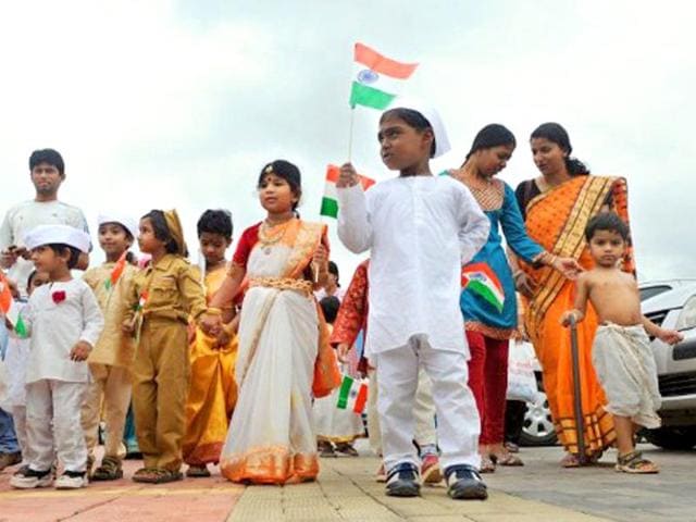 Young supporters of Anna Hazare's mass movement on anti-corruption attired in costumes of freedom fighters arrive at a rally held in Bangalore's Freedom Park.