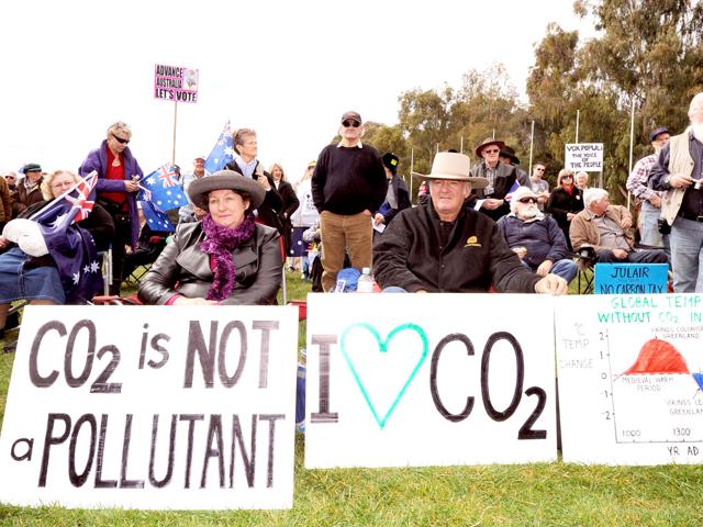 Anti-carbon tax protesters known as The Convoy of No Confidence listen to speeches in front of Parliament House in Canberra. The national convoy of disgruntled Australian truck drivers and farmers descended on Canberra to protest government policies including plans for a pollution tax.