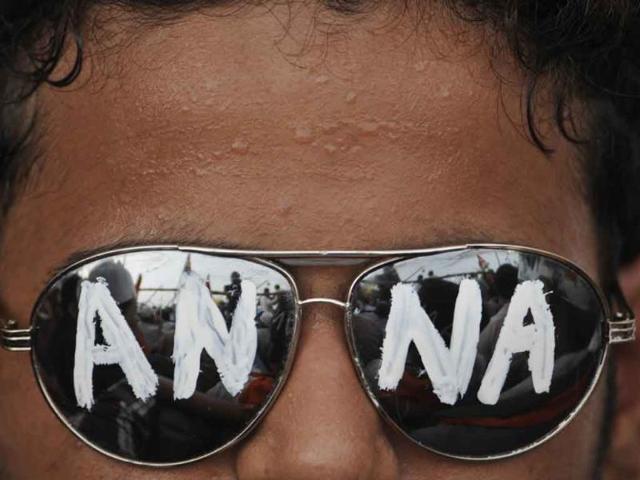 A supporter of anti-corruption activist Anna Hazare sports a sunglass that reads 'Anna' at the fast venue in New Delhi.