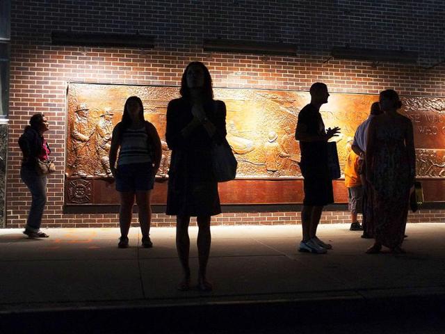 People look out at the World Trade Center site in New York City.