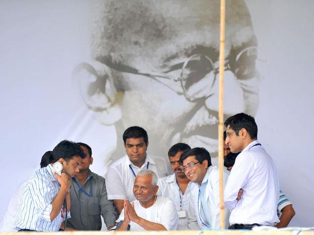 A team of doctors check Anna Hazare as he gestures towards his supporters during a rally at Ram Lila grounds in New Delhi.
