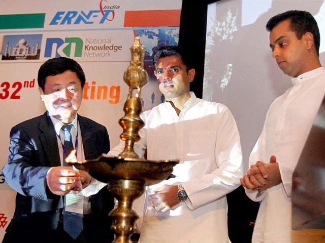 Ministers of state for communications and information technology, Sachin Pilot and Milind Deora light a lamp during the 32nd meeting of Asia Pacific Advance Network (APAN) in New Delhi.