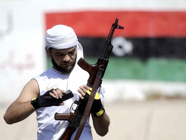 A rebel fighter is pictured in Tripoli. Libyan rebels declared the Gaddafi era over after storming Tripoli, but one of the veteran strongman's sons insisted the battle was far from done as he defiantly refuted reports of his arrest.