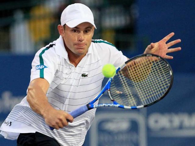 Andy Roddick of the USA returns a shot to Edouard Roger-Vasselin of France during the Winston-Salem Open at the Wake Forest University Tennis Complex in Winston-Salem, North Carolina.