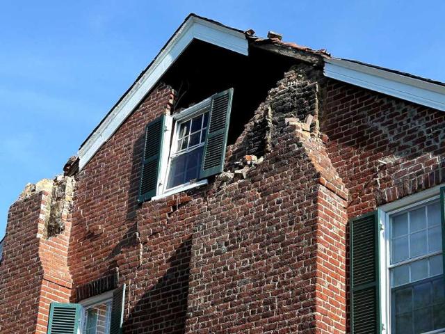 An historic home belonging to Jane and Percy Wootton is shown damaged by the early afternoon 5.8 earthquake whose epicenter was located nearby in Cockoo, Virginia.